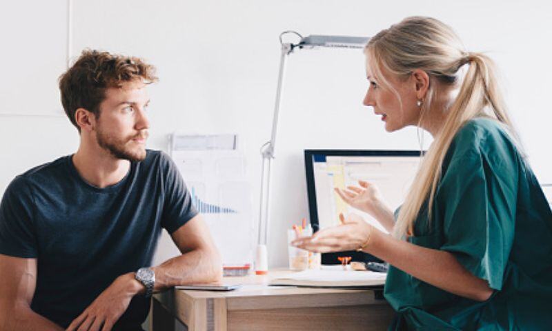 Man having a in-depth consultation at their private clinic